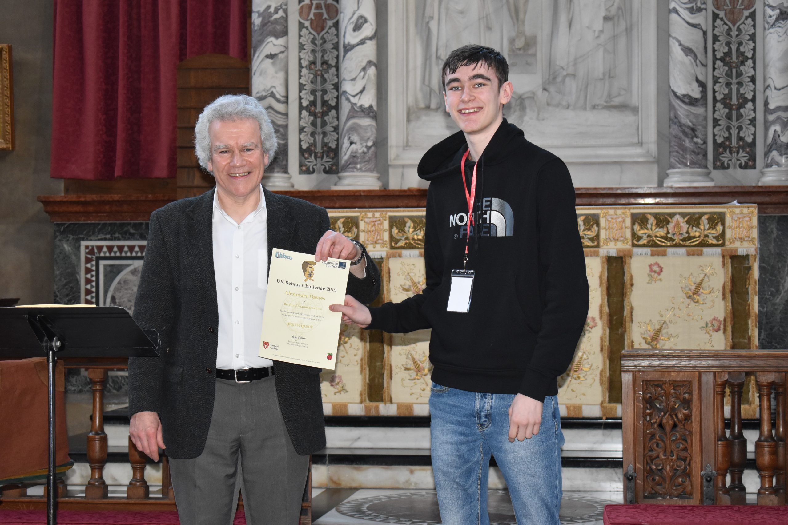 Alex receiving his finalist's certificate from Peter Millican, Professor of Philosophy at Hertford College, University of Oxford