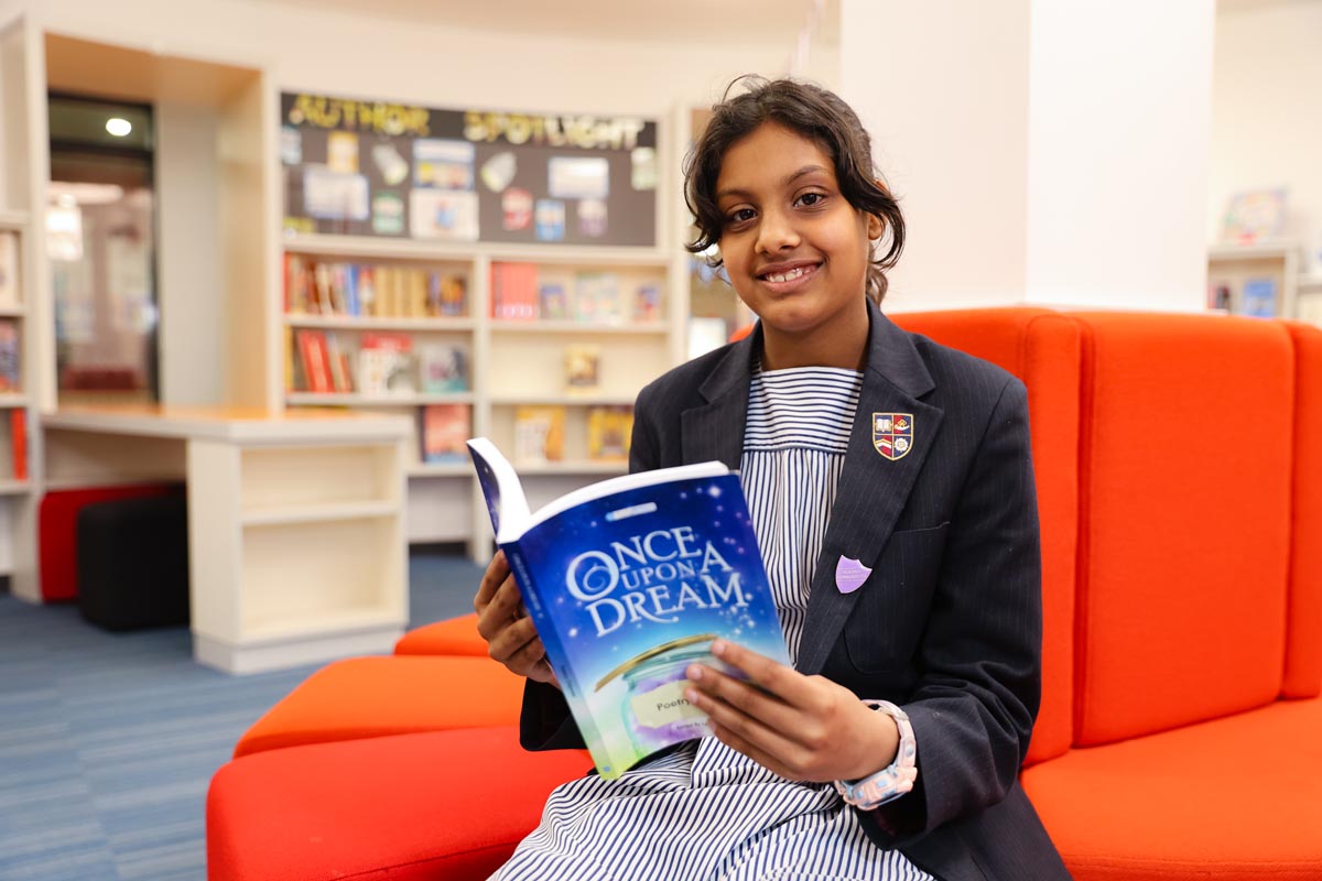 Schoolgirl with a book in hand