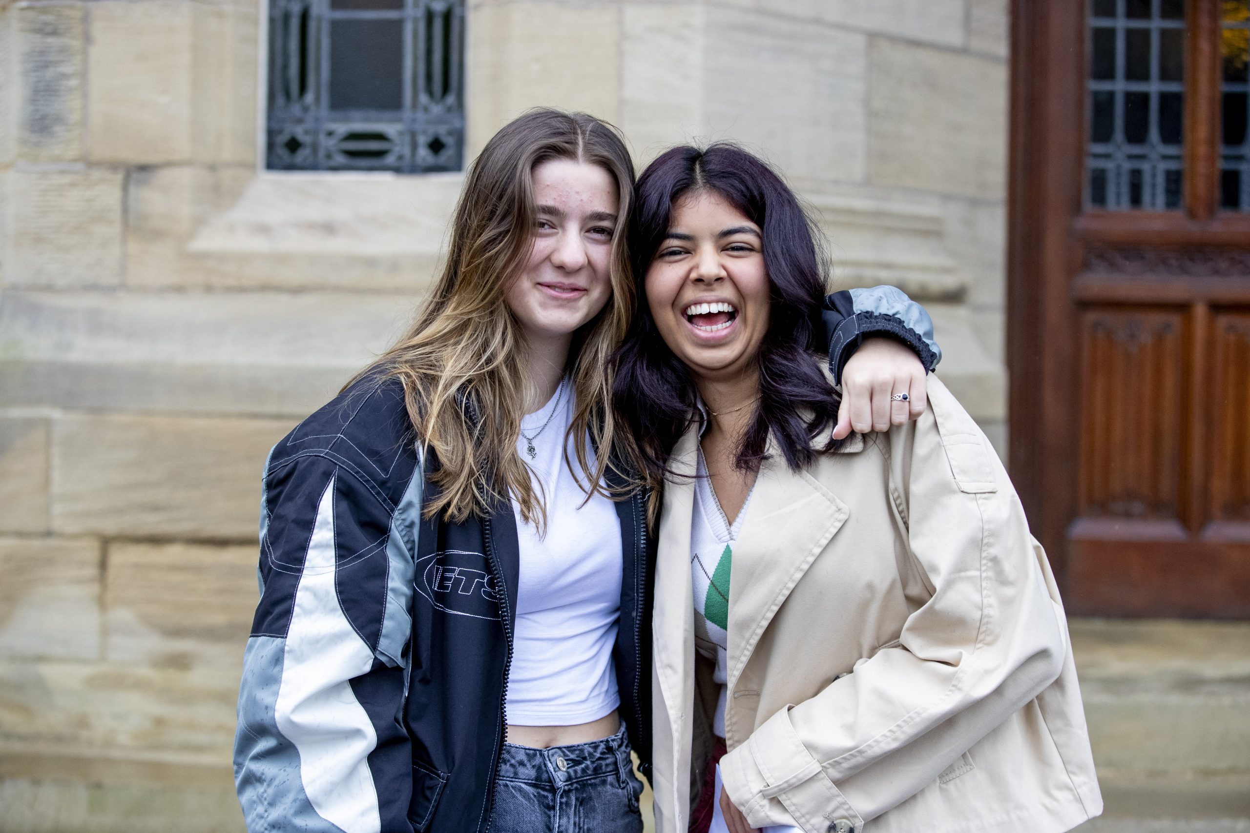 Two students smiling