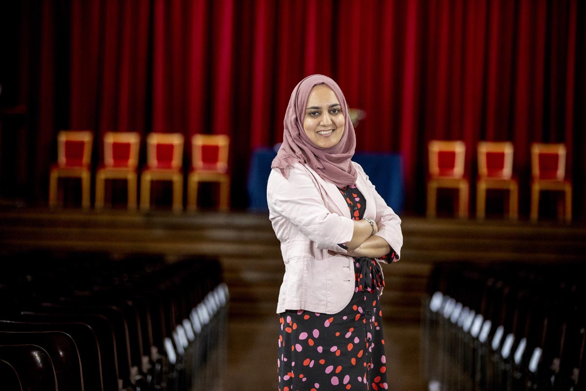 Woman smiling with her arms crossed