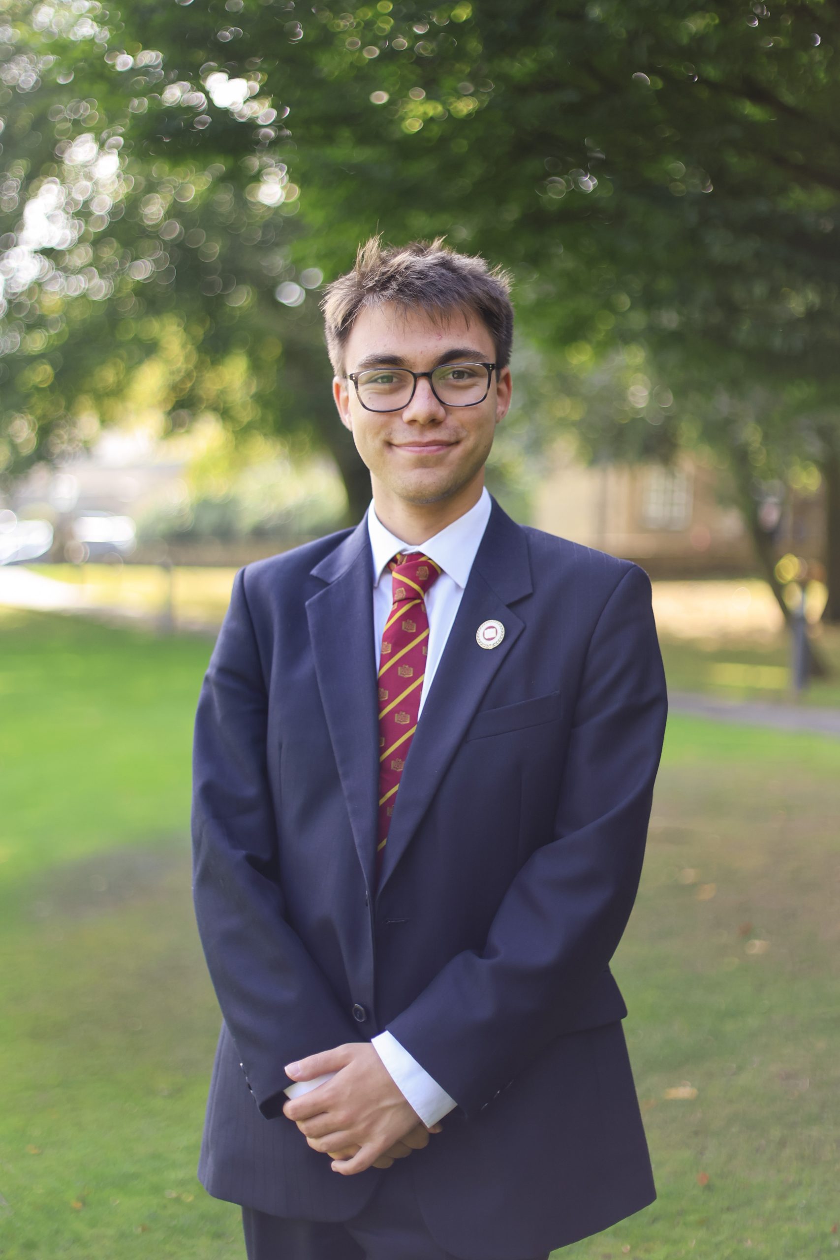 James stood smiling on school grounds