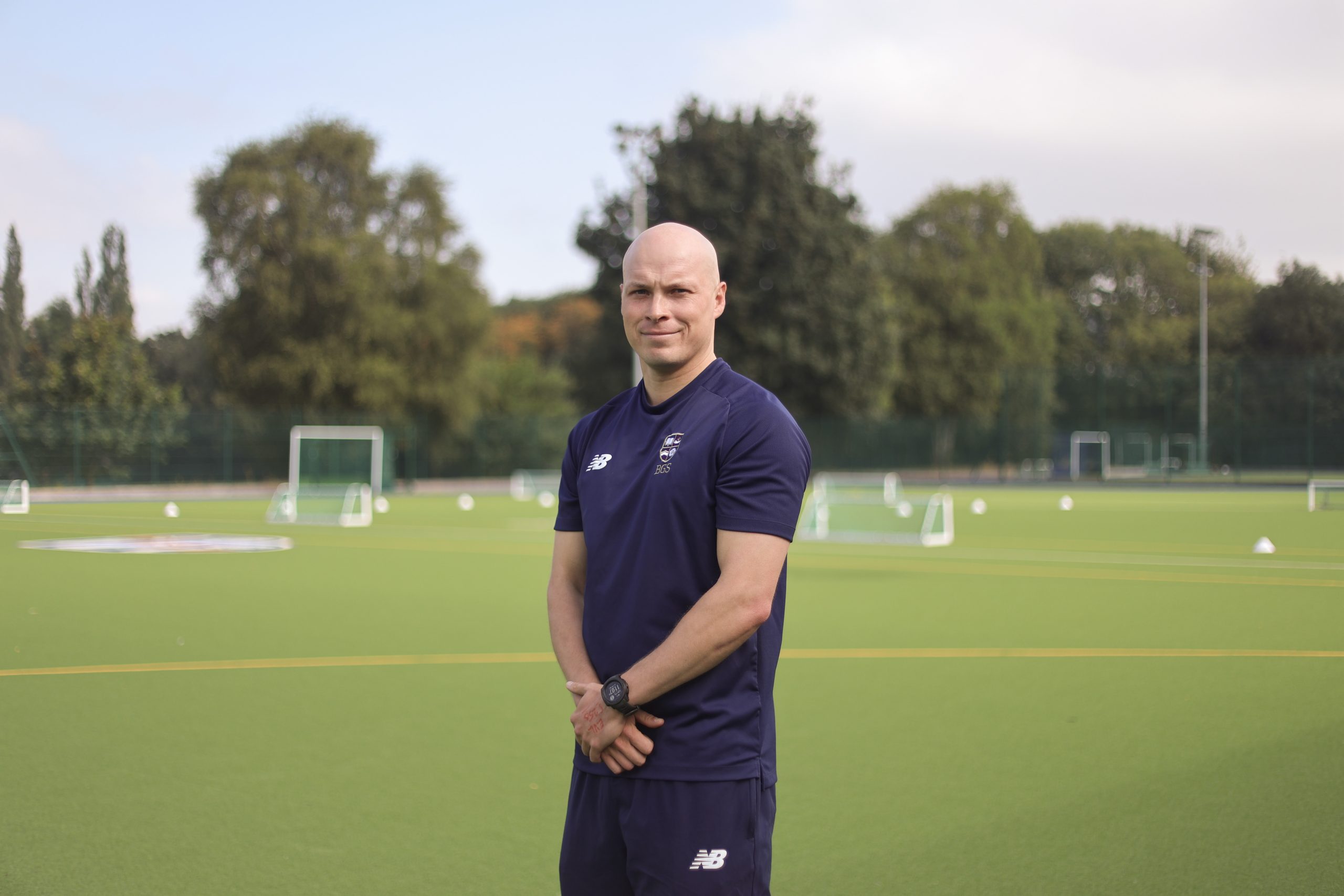 Jack stood smiling on a sports field