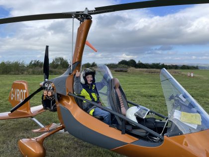 Nicky sat in a gyrocopter